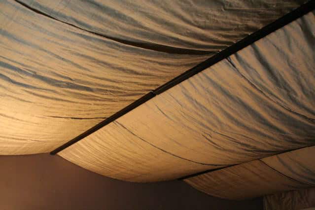 fabrics draped on your basement ceiling